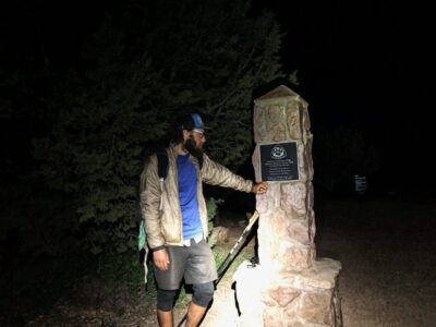 Jeff Garmire (Legend) looking at a a terminus at night