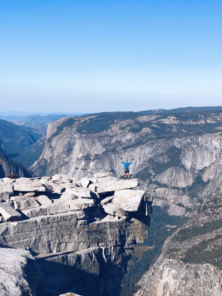 One of the many thru-hikers that pose standing on the edge of a cliff!