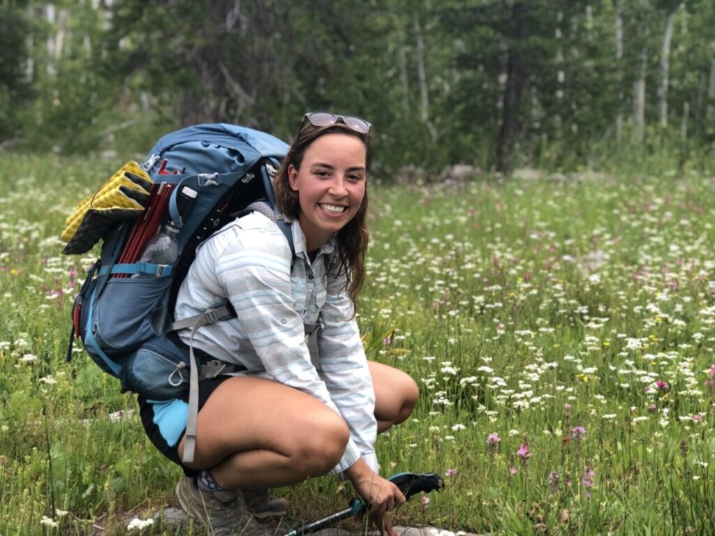 Flower Power posing in front of a meadow with flowers.