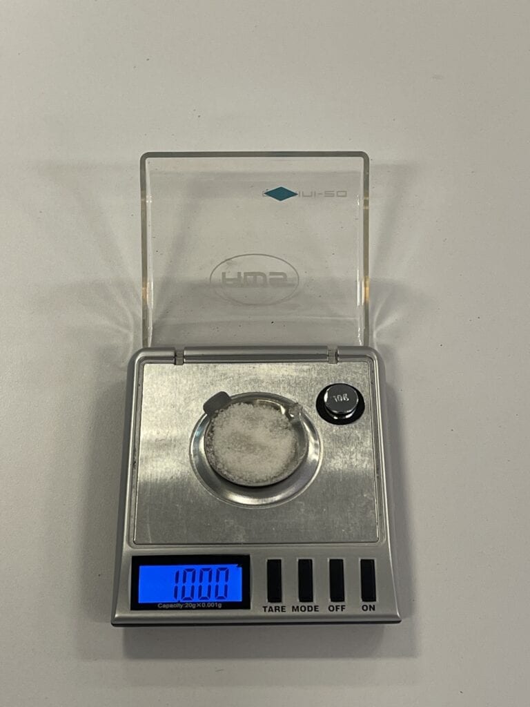 the gel from a WAG bag being weighed onto a scale