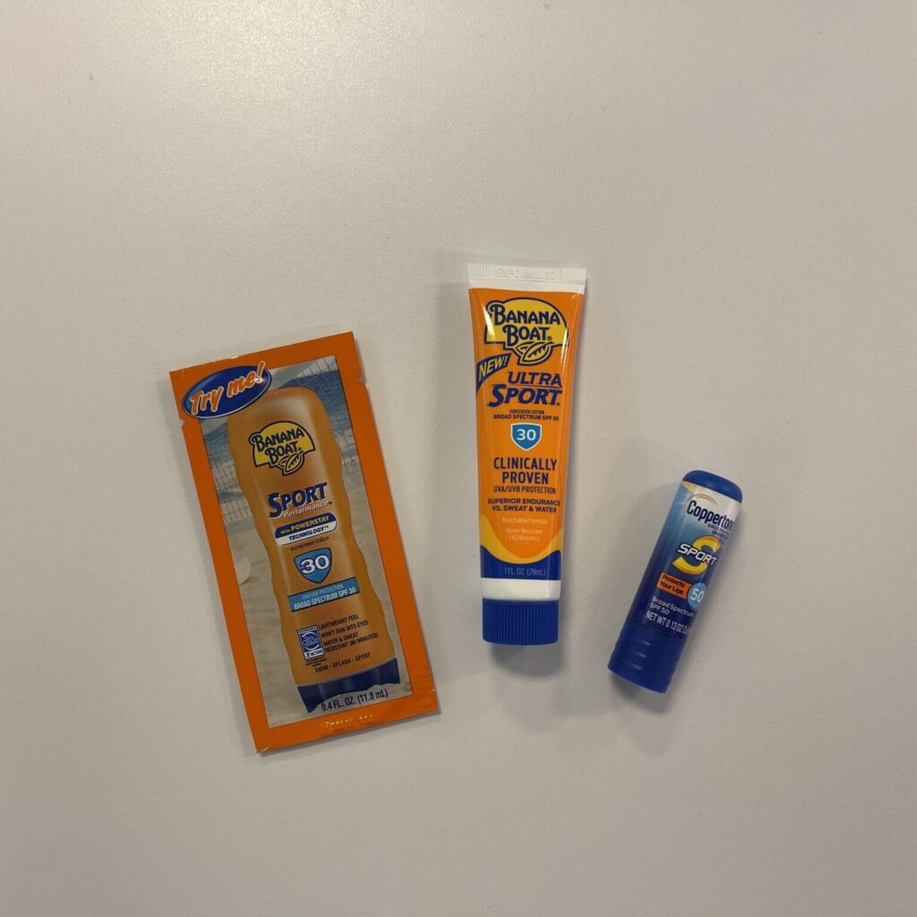 sunscreen and lip balm shown