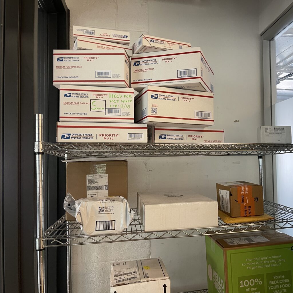 photo of hiker packages in a mail room
