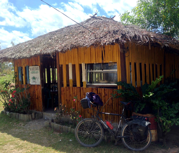 Bike leaning against a small building along the Timor Leste