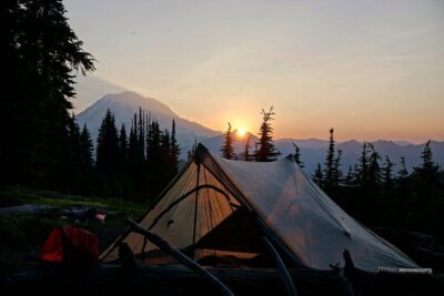 tent with a sunset in the background