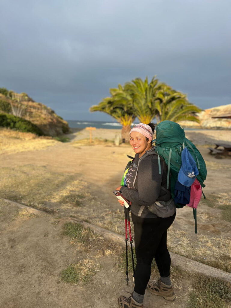 A hiker with a backpack on getting ready to hike the Trans Catalina Trail