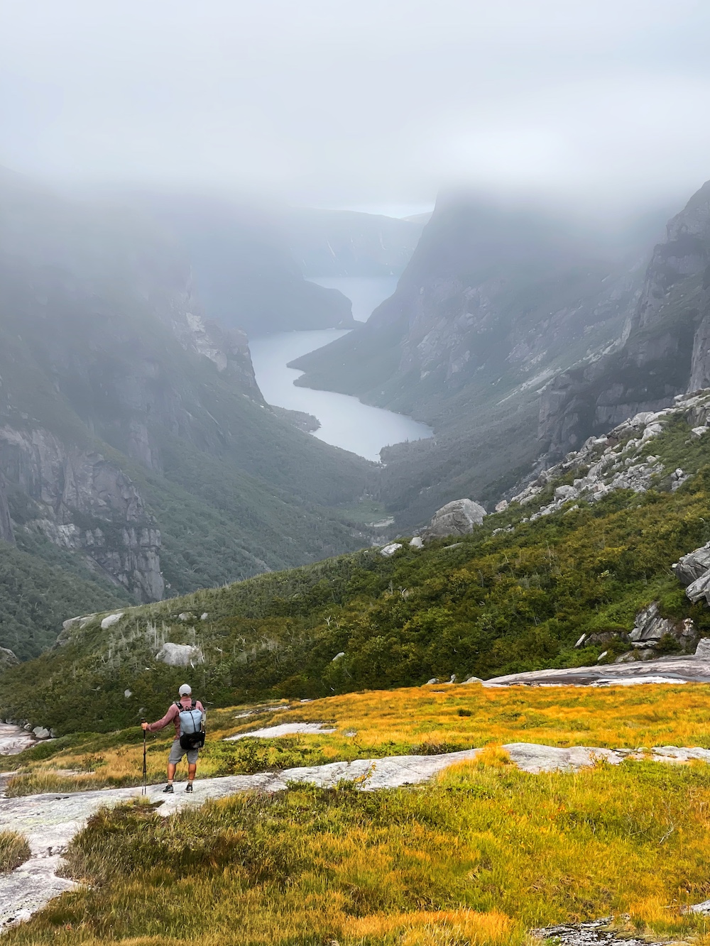 A hiker standing on a mountain side on the ECT
