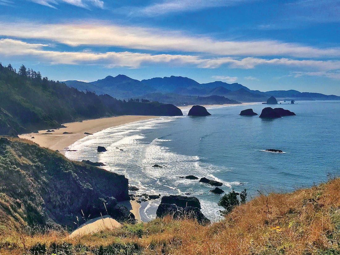 a view of the beach and ocean on the coast of oregon