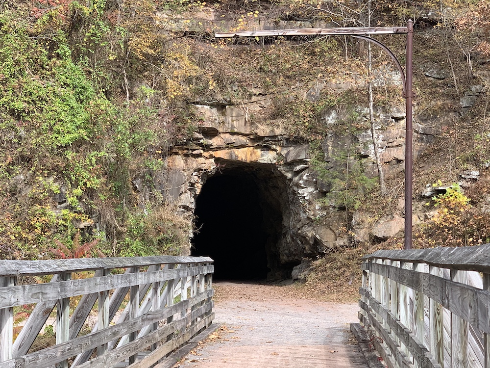 a tunnel with a bridge in front of it