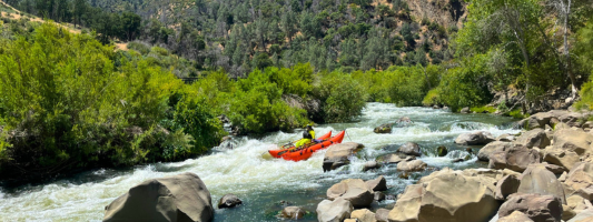 a whitewater rafter in cache creek