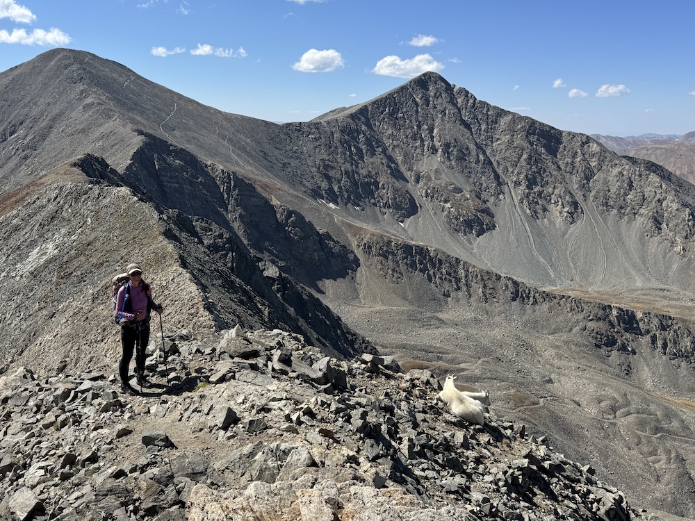 a hiker standing on top of a mountain