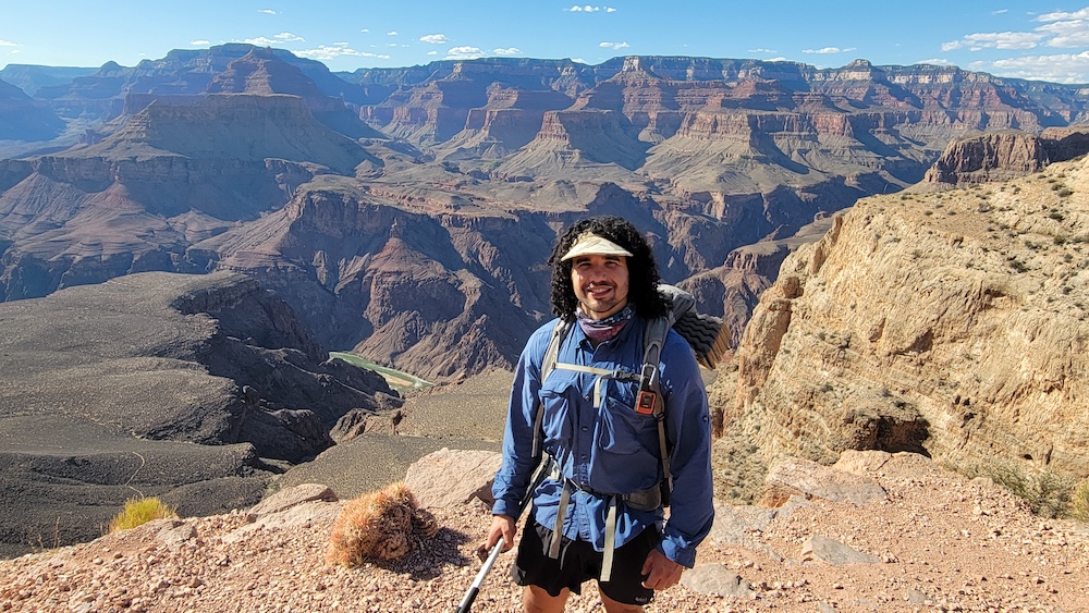 a hiker posing in the Grand Canyon