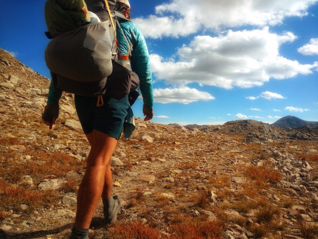 Wind River Range, WY a hiker walking on trail with a backpack