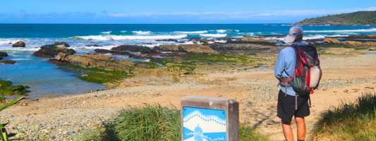 a hiker along the Yuraygir and Solitary Islands Coastal Walks