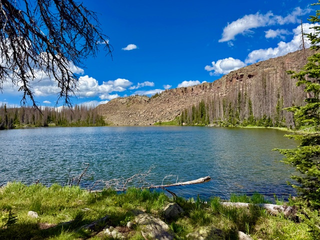 a lake at the bottom of a mountain