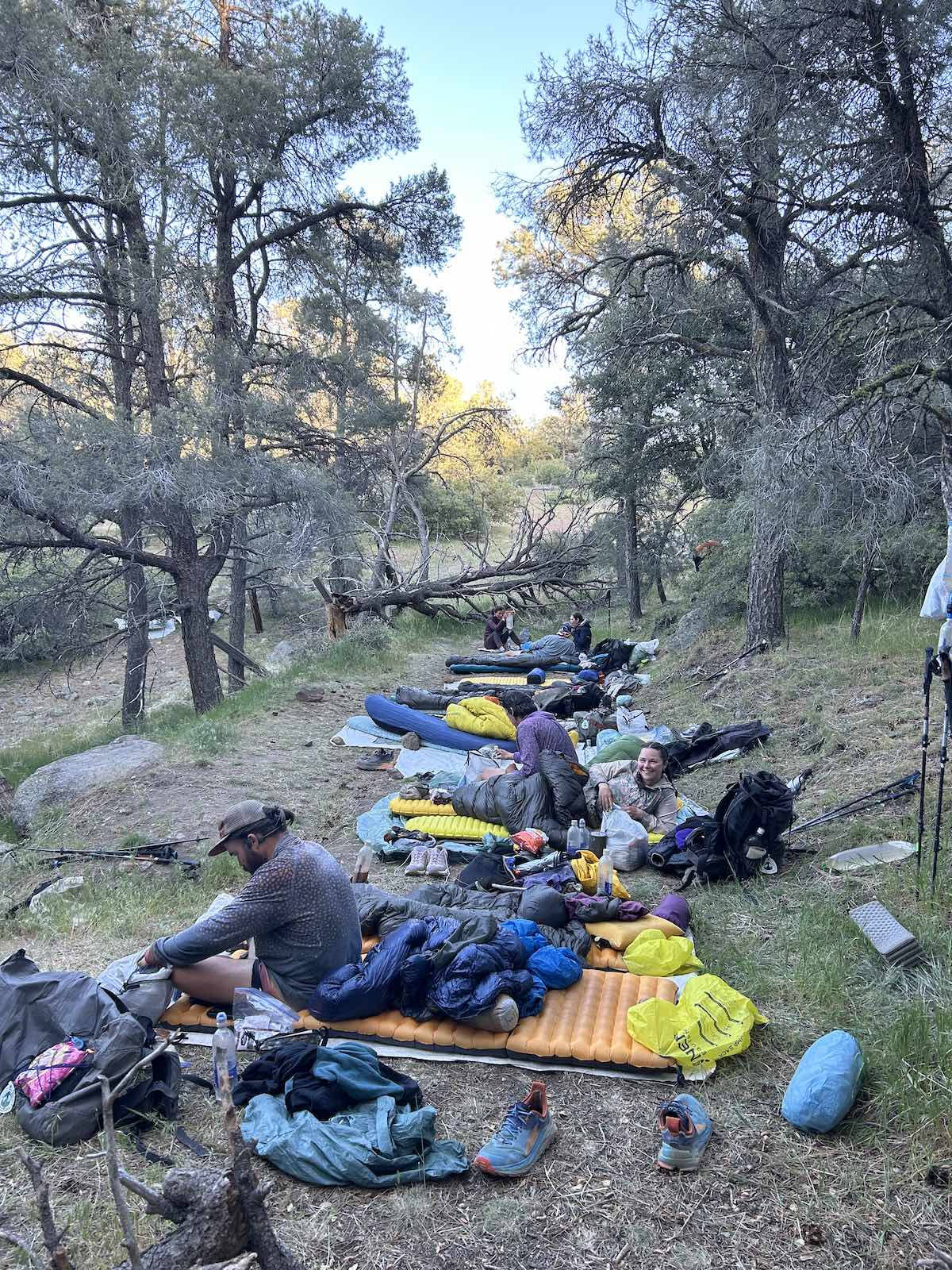 a big group of thru-hikers cowboy camping