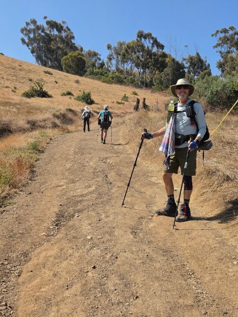 hikers on a hill on the Trans Catalina Trail