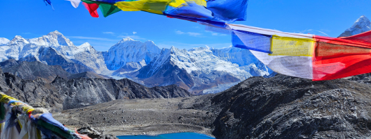 a colorful banner with mountains in the background
