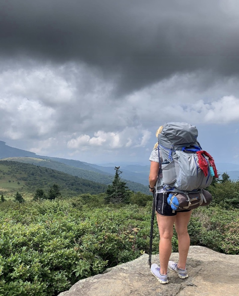 AT_hiker_pack a hiker with a backpack on standing on a rock looking out over the forest on the AT