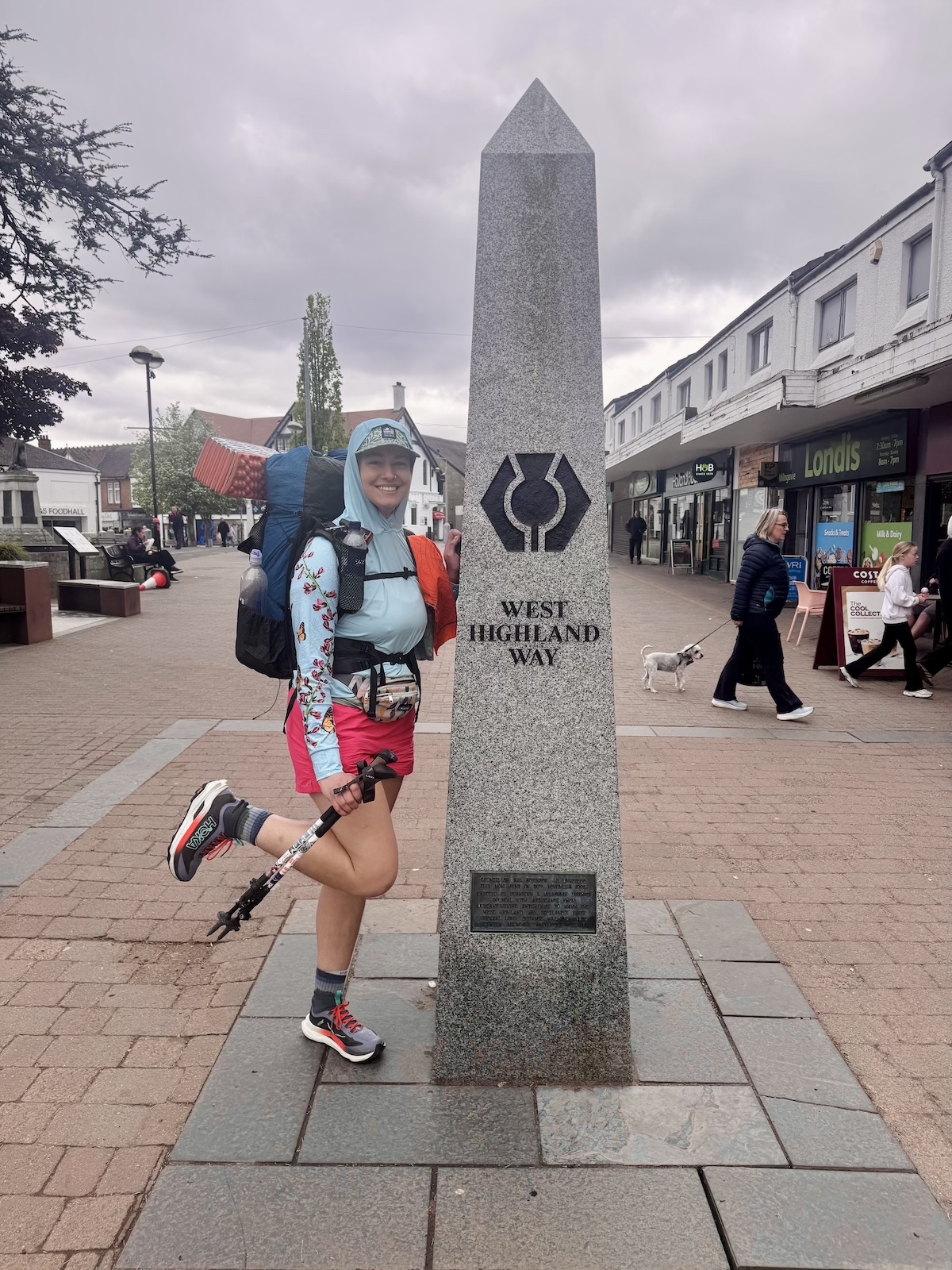 west_highland_way_terminus a hiker posing by the West Highland Way terminus