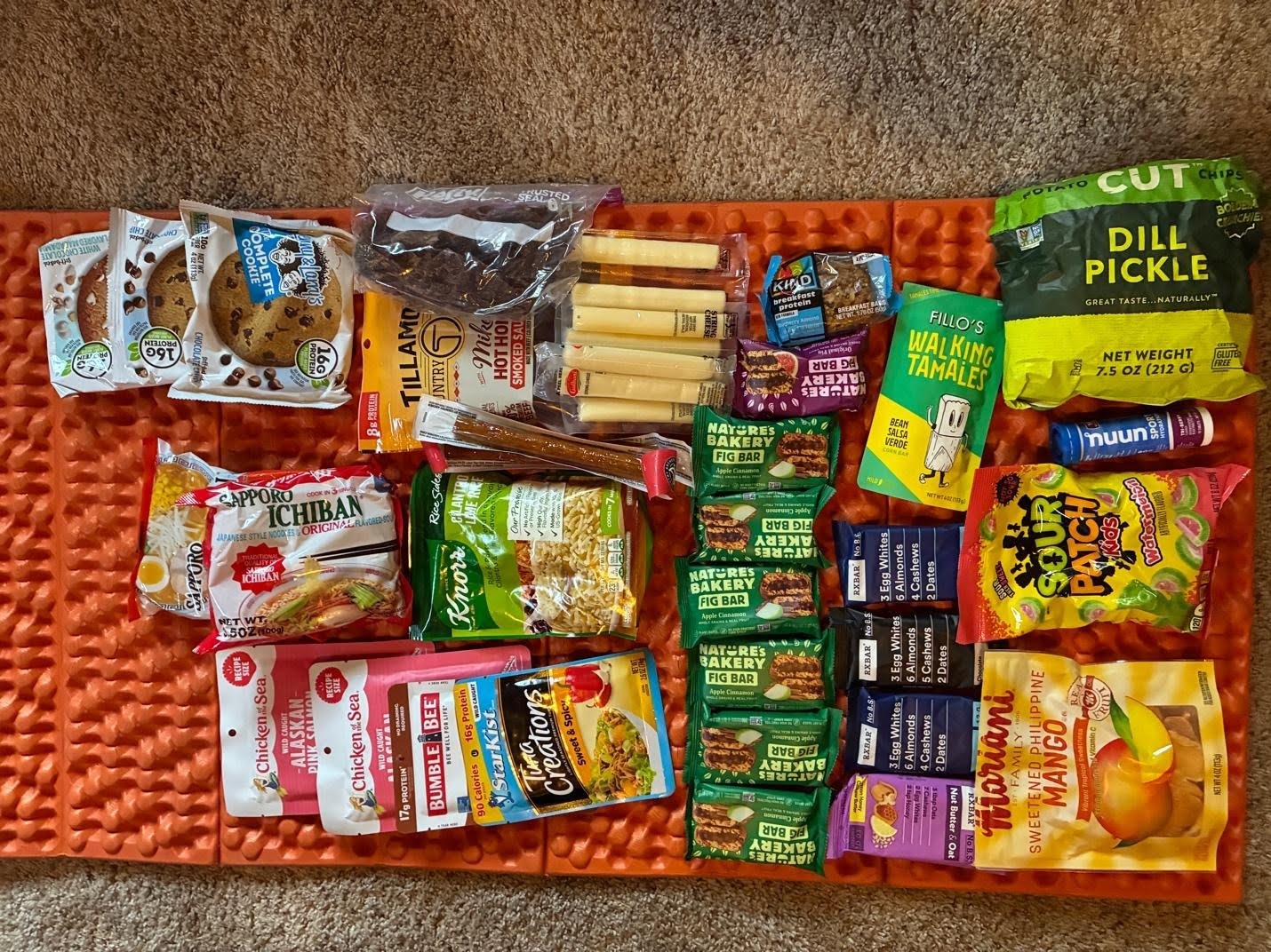 thru-hikers food laid out on the ground